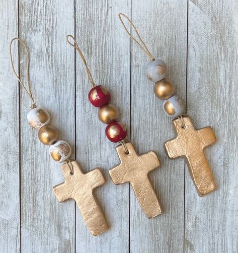 "These beautiful small gold cross ornaments are finished with either white, grey or red hand painted beads with a brushed gold finish. They are unique and make a very special gift during the Holiday season. These crosses make beautiful ornaments that can hang from your tree, door knob, alone or as a set on a wall. They also make adorable gift tags...the options are endless. These particular crosses measures approx. 3\" high x 3\" wide. They are handmade with clay so variations will occur. You ca Diy Cross Ornaments, Hand Painted Christmas Gift Tags, Cross Ornaments Diy, Wooden Crosses Handmade, Cross Ornaments, Hand Painted Crosses, Pocket Cross, Clay Cross, Tree Door