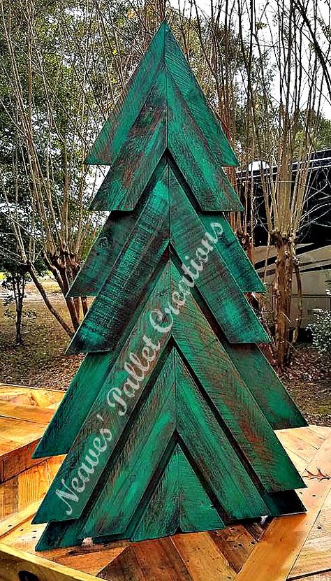 RECYCLED WOOD PALLET: Here is our painted and stained Double-Angled Christmas Tree we posted earlier. We can make more in red, just stain or white. This one is free standing but we can make it with a yard stake. Right now this is the only size we make, it is 45" tall x 25" wide and we are asking $50. That's painted and or stained. (This has the wood of a double pallet wood tree.) Message us if you would like to place an order. Item # 1,282 Wooden Pallet Trees Christmas, How To Decorate A Wooden Pallet Christmas Tree, Pallets Christmas Trees, Holiday Pallet Ideas, Pallet Xmas Tree Ideas, Pallet Wood Christmas Trees, Handmade Wood Crafts Ideas, Pallet Wood Christmas Projects, Fence Wood Projects