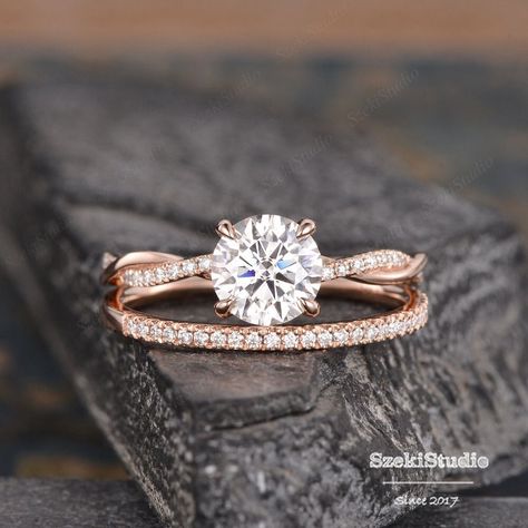 "Moissanite Engagement Ring Rose Gold Twist Infinity Solitaire Moissanite Diamond Half Eternity Ring Bridal Women Promise Ring Anniversary Same design with 6 prongs: https://www.etsy.com/listing/643797587 Interested in bridal set: https://www.etsy.com/listing/651183149 Same design with different gemstone: https://www.etsy.com/listing/609590330 https://www.etsy.com/listing/655314606 https://www.etsy.com/listing/654797976 ITEM INFORMATION Metal Type - Solid 14k Rose Gold Band Width - (approx. 2.3mm) Center Stone - 7mm Moissanite, Round Cut Clarity - VVS Color -  D-E-F Side Stone - Natural Diamond, H color , SI clarity Or Moissanite, D-E-F color, VVS clarity Weight - 0.3ct total **Stone Replacement** Available with any other gemstones, please feel free to contact me for a quote. **Metal Type* Engagement Rings With Rose Gold, Wedding Ring With Infinity Band, Engagement Rings Braided Band, Rose Gold And Silver Wedding Ring Sets, White And Rose Gold Engagement Rings, Moissanite Twist Engagement Ring, Silver And Rose Gold Engagement Ring, Rose Gold Rings Engagement Simple, Rose Gold And Silver Engagement Ring