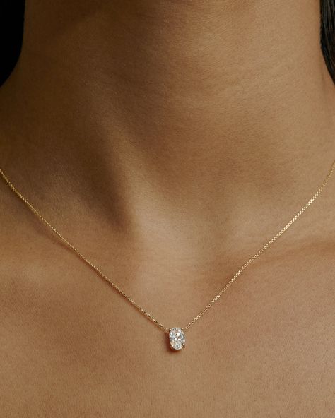 Our Oval Diamond Necklace in 10-karat gold features an oval diamond in a fine four claw setting complementing the stone on our signature fine chain. Elements of this necklace including chain length and diamond carat can be made bespoke upon request.