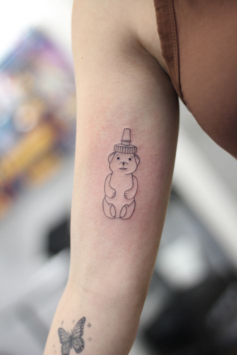 honey bottle tattoo line work black work minimalist tattoo Honey Bear Bottle Tattoo, Honey Bottle Tattoo, Honeybear Tattoo, Honey Dipper Tattoo, Honey Pot Tattoo Simple, Small Honey Jar Tattoo, Honey Tattoo Ideas, Honey Bear Tattoo, Honeypot Tattoo