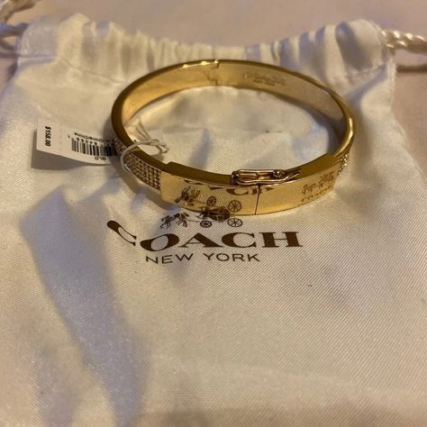 Gold And Crystal Coach Hinge Bangle. Has Magnetic Clasp And Latch Above. Comes With Bag Classy Jewlery, Coach Bangle, Classy Purses, Dope Jewelry Accessories, Perfume Jewelry, Coach Jewelry, Dope Jewelry, Jewelry Essentials, Stacked Jewelry