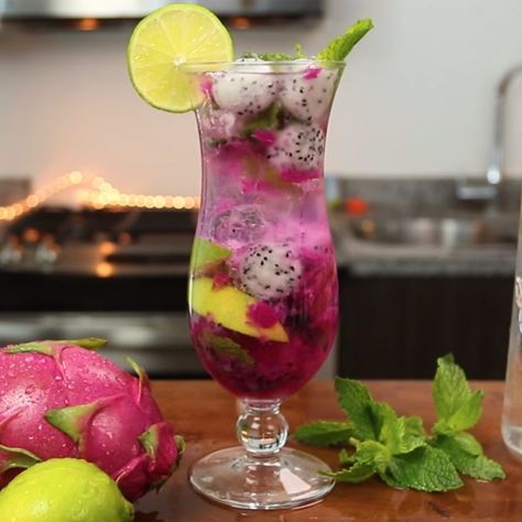 The Dragon Fruit Mojito is one of the tastiest variations on the classic Mojito recipe we've ever tried. This beautiful, fruity mixed drink combines coconut rum, simple syrup, lemon-lime soda, dragonfruit, lime wedges, and mint leaves, and tastes like a refreshing burst of relaxing island life. Fruit Mojito, Mojito Recipe Classic, Fruity Mixed Drinks, Easy Mixed Drinks, Mojito Ingredients, Classic Mojito, Dragon Fruit Smoothie, Mint Simple Syrup, Mojito Cocktail