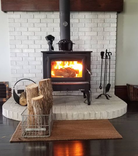 Brick Wood Stove Hearth Ideas -chefkozmo Wood Stove Interior Design, Woodstove Hearths Brick, Wood Stove Fireplace Mantle, Hearth Ideas Wood Stove, Brick Heat Shield For Wood Stove, Wood Stove In Kitchen Ideas, Wood Burning Stove Mantel Ideas, White Brick Wood Stove, Fireplace Brick Hearth