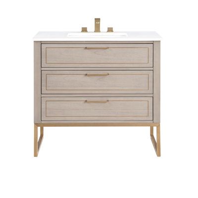 The stately elegance of the Markham vanity collection is highlighted by its clean lines and material contrast. The three to six-drawer cabinet traces each angle with urbane style and presence. Elevated on a frame of satin brass, the drawers contrast in the real wood veneer of cashmere gray, walnut, or lacquered black. Slim, soft-glide horizontal pulls and delicate metal inlays accentuate the dresser's façade with its sophisticated charm. Base Finish: Cashmere Grey, Top Finish: Quartz | BEMMA Mar 3 Drawer Bathroom Vanity, 36” Bathroom Vanity, 30 Inch Bathroom Vanity, 36" Vanity, Drawer Vanity, Contemporary Bathroom Vanity, Plywood Panels, Bathroom Vanities For Sale, Single Sink Bathroom Vanity