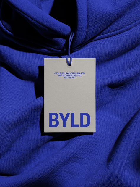 Clothing tag mockup on blue fabric texture ideal for designers to showcase branding, label design, and logos in a realistic setting. Photography based high-quality mockup created for your next design project. What’s included: • Tag Mockup • Created for Adobe Photoshop • Dimensions – 6000×4500 px • Download file – 616 MB, ZIP Branding Label Design, Blue Fabric Texture, Tag Mockup, Clothing Labels Design, Hang Tag Design, Clothing Brand Logos, Bag Mockup, Graphic Design Tools, Brand Fonts