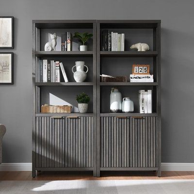 This 3-tier bookshelf with a double-door storage cabinet at the bottom. Crafted from thickened wooden boards, it features wave-patterned panels and adjustable shelves. Perfect for organizing books and essentials while adding a touch of modern flair to your space. | Latitude Run® Nicolee 71" H Storage Bookcase Brown 70.8 x 29.3 x 15.4 in, Manufactured Wood | C110206192_107671494 | Wayfair Canada 5 Tier Bookshelf, Oak Bookshelves, Organizing Books, Bookcase With Doors, Home Office Shelves, 3 Shelf Bookcase, Storage Bookcase, Tall Bookcase, Library Bookcase