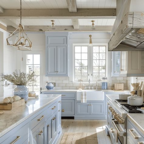 Light and Airy Coastal Kitchen: A Timeless Trend - Lainey May Home Modern Coastal Kitchen Hardware, Luxury Coastal Kitchen, Pale Blue Kitchen Cabinets, Light Blue Cabinets Kitchen, Beach Kitchen Ideas Coastal Colors, Resurface Cabinets, Light Blue Kitchen Ideas, Light Blue Kitchen Cabinets, French Blue Kitchen