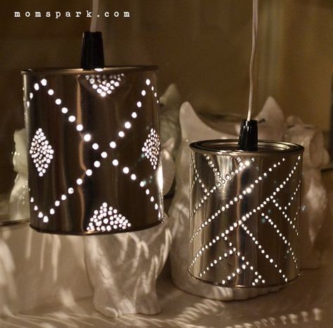 15 Pretty and Practical Ways to Reuse Paint Cans Upcycled Cans, Tin Can Lights, Can Lanterns, Tin Can Lanterns, Recycled Tin Cans, Tin Can Art, Aluminum Can Crafts, Punched Tin, Recycled Tin