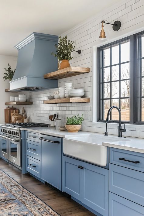 Discover the latest kitchen design trends with this elegant blue cabinetry and rustic wooden shelving. Perfectly combines modern and farmhouse styles with sleek appliances and a cozy vibe. Ideal for anyone looking to revamp their kitchen #LatestKitchenDesign #BlueDecor #FarmhouseStyle Blue Farmhouse Kitchen, Diningroom Ideas, Blue Cabinetry, Kitchen Open Shelves, Blue Kitchen Designs, Wooden Shelving, Farmhouse Kitchen Inspiration, Light Blue Kitchens, Blue Farmhouse