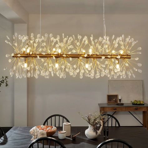 Transform your dining area with the captivating 12-Light Raindrop Bubble Crystal Linear Chandelier, a statement piece that exudes modern luxury. This chandelier's elongated design, adorned with delicate bubble crystal droplets, creates a breathtaking light display that enhances the ambiance of any dining room, kitchen island, or rectangular space. The elegant gold finish adds a touch of opulence, while the high-quality construction ensures durability and long-lasting beauty. Perfect for those se Modern Chandelier Dining Room, Dining Room Chandelier Modern, Chandelier Dining Room, Rectangle Chandelier, Gold Glam, Dining Room Chandelier, Linear Chandelier, Dining Room Kitchen, Light Display