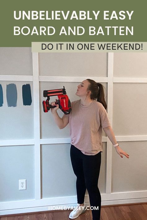 An image of a women holding a nail gun in front of a board and batten wall. The text says "Unbelievably Easy Board and Batten Wall" Diy Board And Batten Wall Mdf, Board And Batten All One Color, How To Build Board And Batten Wall, Cheap And Easy Board And Batten, Easiest Board And Batten Wall, Board And Batten Wall Diy Cheap, Batten Board Walls Diy, Board And Batten Office Wall Ideas, Board And Batten 8 Ft Wall