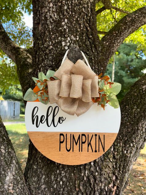 This round Hello Pumpkin sign was handcrafted! Hand painted, vinyl lettering, wood was stained, hung with with cream decor rope. Fall Round Signs, Hello Pumpkin Sign, Cream Decor, Round Signs, Signs Decor, Circuit Ideas, Painted Vinyl, Fall Sign, Pumpkin Sign