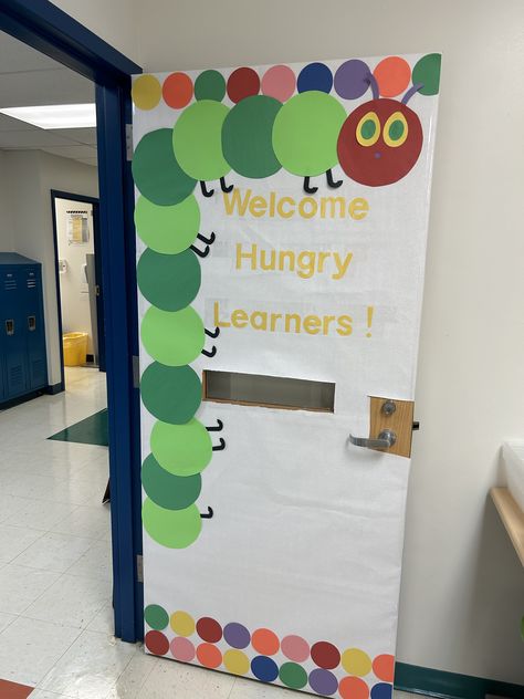 Welcome Sign Front Door For Preschool, Caterpillar Door Decorations Classroom, Hungry Caterpillar Bulletin Board Ideas, Hungry Caterpillar Bulletin Board, Daycare Door Ideas, Preschool Classroom Decorations, Hungry Caterpillar Classroom, Daycare Bulletin Boards, Speech Classroom