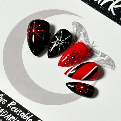 "Welcome to LD Nails!  Hi, I'm Bur and I'll be your long distance nail ghoul 😜 Read on for the obligatory written description of what you see in the pictures, plus some other important stuff..  🖤 One set of 10 REUSABLE Press On Nails 🖤 Sinister Snowflake: black red and white hand painted snowflake Christmas press on nails. 👉 Please leave your finish preference and (if applicable) custom sizing in the personalization box!  Est. 2020: LD Nails specializes in custom Gothic, Witchy and Alternative Press On Nails. I draw inspiration from what I love, so you'll find heavy gothic influences to much of the offerings in my shop!  5 ⭐️ Rating on Etsy & 1000's of orders shipped between this shop and my website!  Check out my other listings to see what else I've got! https://www.etsy.com/ca/shop/L Alt Nails, Nails Witchy, Gothic Winter, Nails Goth, Christmas Press On Nails, Witchy Nails, Country Nails, Snowflake Christmas, Press Ons