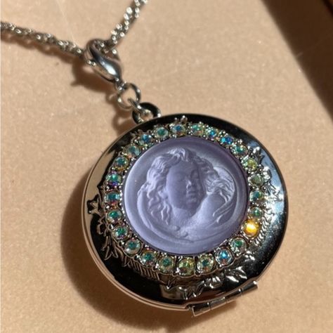 Vintage Kirks Folly Lavender Dream Angel Locket Necklace Silver Tone Opens From The Top. Can Hold Two Photos. Crystals Are Set Around An Iridescent Glass Cameo. The Back Of The Locket Is Engraved With The Words, "Love Never Dies.” Measures 30" Long Locket Is Approx. 1-1/2" Wide X 3/8 Deep. Has Lobster Claw Clasp On Locket And Chain. Aurora Borealis Rhinestones. New In Box Unique Locket Necklace, Angel Locket, Locket Necklace Silver, Vintage Locket Necklace, Charm Holder Necklace, Unique Locket, Clock Necklace, Jellyfish Pendant, Kirks Folly Jewelry