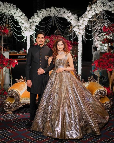 Indian couple Indian Bride Gown Receptions, Engagement Indian Couple, Designer Reception Outfit, Reception Look For Indian Couple, Couple Shadi Dress, Reception Look Bride And Groom Indian, Engegment Dresses For Groom, Reception Dress Bride Gown, Sangeet Outfit For Couple Indian