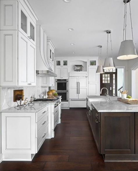 Large white kitchen boasts an exquisite dark brown island topped with white marble countertops holding a farmhouse sink fitted with a polished nickel gooseneck faucet illuminated by three Lily Hanging Shades. Kitchen With Brown Cabinets, Kitchen With White Cabinets, Brown Kitchen Cabinets, Refacing Kitchen Cabinets, Kitchen Diy Makeover, Brown Cabinets, Diy Kitchen Renovation, Farmhouse Kitchen Cabinets, Brown Kitchens