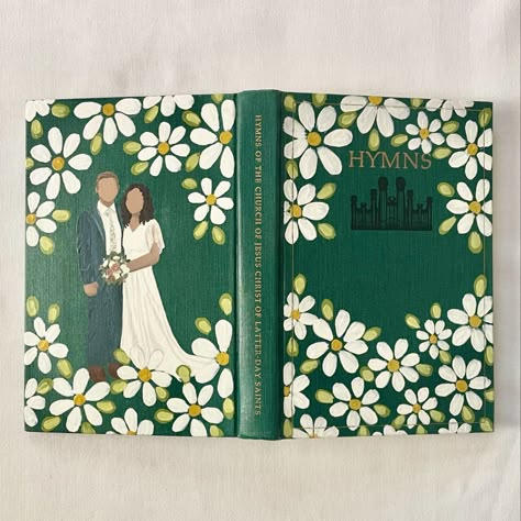 I painted this hymn book for one of my best friends’ wedding! Swipe to the end to see the reference photo 💛 #paintedhymnbook #ldshymns #paintedscriptures #paintedbookofmormon #ldsart #hymnbook Painted Books Of Mormon, Book Of Mormon Art, Lds Hymns, Cute Art Drawings, Lds Crafts, My Best Friends Wedding, Bible Painting, Book Of Mormon Scriptures, Best Friends Wedding