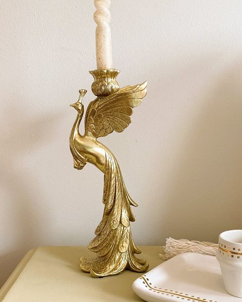 Our Gold Peacock Candle Holder is a beautiful and elegant addition to your home decor. Perfectly refined, it is an absolute eye-catcher that lights up your home in an elegant way. The lustrous gold finish is warm and inviting, providing a beautiful glow when burning a candle. If you love collecting candles or have been gifted a couple of them and are yet to set them up, this unique piece is the ultimate pick. We love it in combination with our Ceramic Nespresso Cup Caftan, Ceramic Tray Caftan an Peacock Candle, Twisted Candle, Paradise Bird, Twist Candle, Baroque Decor, Gold Peacock, Ceramic Tray, Pretty House, Candle Set