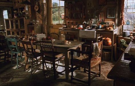 The Burrow, home of the Weasley family.  Ron: "It's not much, but it's home." Harry: "I think it's brilliant.” Me, too, Harry. The Burrow is my dream home, especially the kitchen. Slytherin Queen, Headcanon Harry Potter, Weasley Family, Mismatched Chairs, Baba Jaga, Potter Quotes, The Burrow, Spell Books, Fantastic Beast