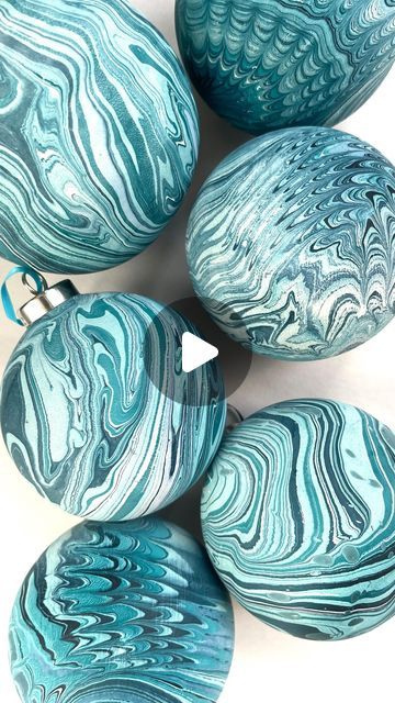 Mercedez Rex on Instagram: "Y’all I’m popping up this weekend and I’m bringing a DIY marbled ornament station for you to dip dye your own ceramic baubles 🤗 It’s gonna be cute! This Sunday Dec 10th 12-5 at @hotelmagdalena" Marbled Baubles Diy, Marbling Ornaments Diy Christmas, Christmas Bobbles Diy, Paint Your Own Baubles, Paint Dipped Ornaments, Marbelized Ornaments, Marble Ornaments Diy, Bauble Painting Ideas, Decorating Baubles