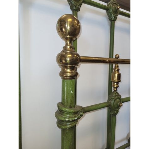 Fantastic antique green enamel painted iron bed frame with brass accents. Dating to the early 20th century, factury painted with a moss green enamel paint, in an iron frame, designed with detailed iron and brass motifs. Measuring 46 inches wide and 57 inches tall for the headboard and 46 inches wide and 43 inches tall for the foot board. This is a rare form bed in good condition; minor dings to brass finials and minor paint chips. No Rails. Extremely heavy. For a small extra charge I can have ra Vintage Brass Headboard Bedroom, Gold Accent Bedroom, Brass Bed Bedroom Ideas, King Iron Bed, Vintage Iron Bed, Gold Accents Bedroom, Painted Iron Beds, Brass Headboard, Bedroom Antique