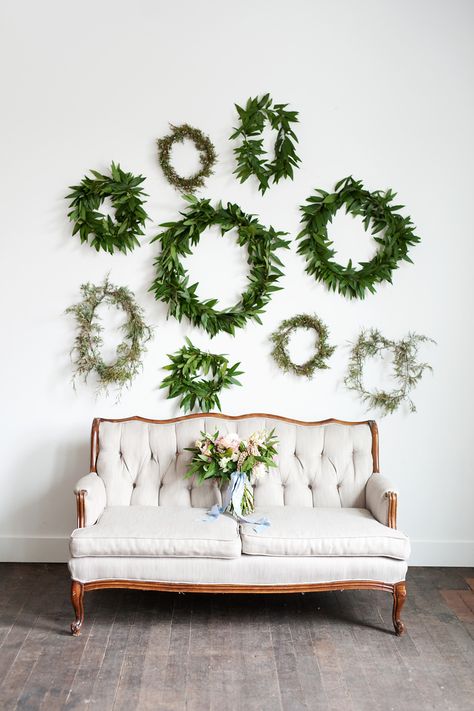 Photography: Kristina Curtis - www.kristinacurtisphotography.com  Read More: http://www.stylemepretty.com/2015/04/03/dreamy-spring-inspiration/ Wedding Backdrop Greenery, Diy Wedding Wreath, Wall Greenery, Backdrop Greenery, Christmas Mini Shoot, Greenery Wall, Holiday Mini Session, Christmas Shoot, Christmas Mini Sessions