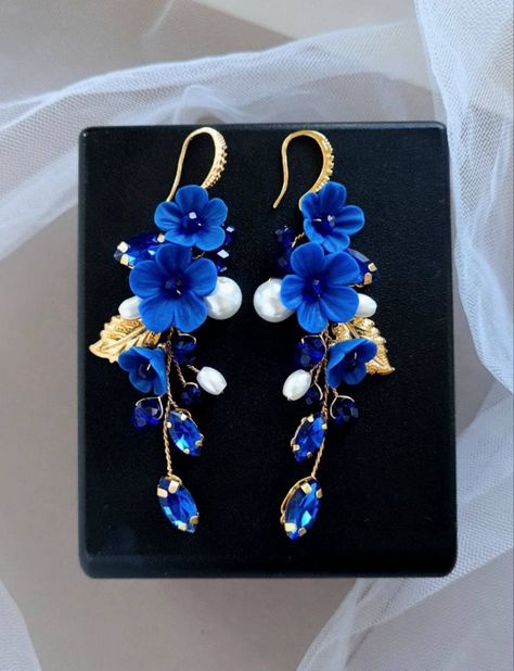 Dark blue earrings are light and ellegant. Earring length about 3 inches. The clasp on the earrings is made of hypoallergenic metal. Dark blue flower earrings consist of ceramic pearls, crystal rhinestones, crystal beads, polymer clay flowers, jewelry wire. * All orders from the Exclusive Wedding Shop you will receive in a FREE beautiful gift box. * Standard shipping: - USA: 12-15 business days - Europe: 3-5 weeks - Canada: 6-10 weeks - Australia: 6-10 weeks - Rest of World: 4-10 weeks * Express shipping UPS: 7-9 business days (around the world). If you have any questions about this product - please contact me. I will be happy to help you. Thank you for visiting my shop.  With best wishes, your Julia Bushmanova 💕 Blue Earrings Wedding, Royal Blue Earrings, Ethereal Jewelry, Dark Blue Earrings, Navy Blue Earrings, Earrings Bride, Flowers Dark, Quilled Creations, Crystal Earrings Wedding