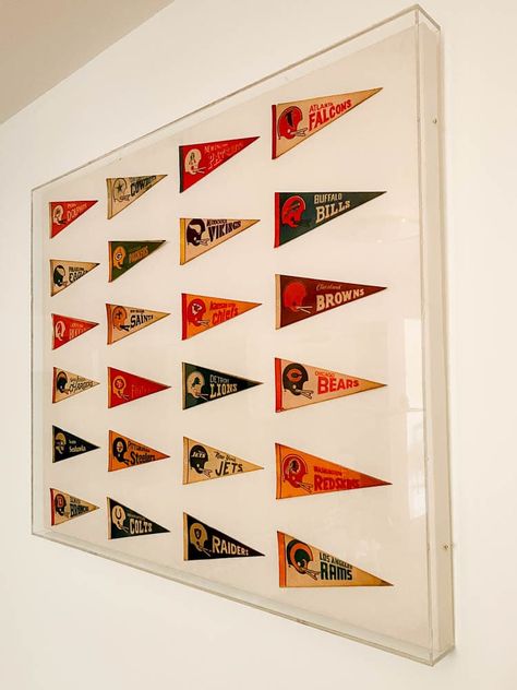 Sports Flags Decor, Sports Pennant Display, Framed Flag Decor, Hanging Pennants On Wall, Pennant Display Ideas, Vintage Pennant Decor, Pennet Flag Decor, Vintage Pennants Display, Sports Display Ideas