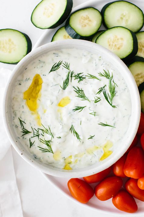 Tzatziki is a creamy, yogurt-based sauce made from thick yogurt, grated cucumber, and fresh dill! Tsaziki Recipe, Best Tzatziki Recipe, Downshiftology Recipes, Greek Tzatziki Sauce, Greek Tzatziki, Cucumber Yogurt Sauce, Tzatziki Recipe, Tzatziki Sauce Recipe, Vegan Tzatziki