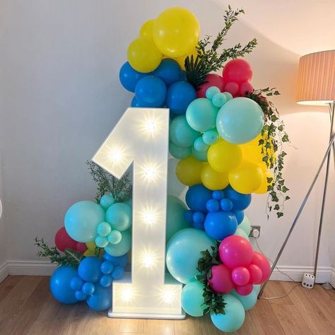 Light Up Numbers With Balloons, Baby Boy 1st Birthday Party, Baby Boy 1st Birthday, Colourful Balloons, Birthday Numbers, 1st Boy Birthday, Balloon Arch, 1st Bday, 1st Birthday Parties