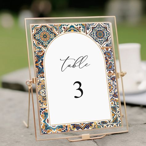 Spanish Wedding Table Number Printable Template, Tuscan Italian Table Number, Mediterranean Table Decor, Mosaic Tiles, Instant Download Use this Spanish wedding table number printable template to edit all wording, font and font color to match your event style. These templates can be accessed through Corjl.com; an online editor that allows you to personalize your templates without installing any software or fonts. You will receive an email from Corjl.com just moments after purchase to begin personalizing your templates. Download and print with any professional service/local print shop.  👉 TRY THE FREE DEMO: https://www.corjl.com/d/1J7ILN 👉 WHAT YOU WILL GET: Customizable templates for the following items: ∙ 5x7 table numbers  ∙ 6x4 table numbers ❤️ MATCHING ITEMS: https://www.etsy.com/sho Mosaic Wedding Decor, Mediterranean Inspired Wedding, Tile Wedding Decor, Spanish Wedding Decor, Wedding Signage Design, Spanish Style Weddings, Mediterranean Table, Mosaic Wedding, Spanish Style Wedding