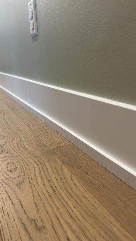 Diy Modern Baseboards And Trim, Large Trim Molding, Modern Home Baseboards, Modern Floor Molding, How To Heighten Ceilings, Thick Baseboard Trim, Modern Wood Baseboards, Modern Farmhouse Baseboards And Trim, Flooring Trim Baseboards