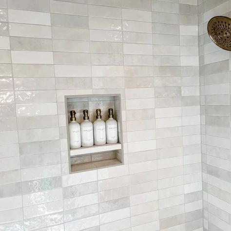 Looks beautiful! We did Frost colored grout by Mapei. Matches great! Shampoo pumps are from The Polished Jar on Etsy. Delta shower set in Champagne Bronze. https://www.wayfair.com/home-improvement/pdp/bedrosians-cloe-25-x-8-ceramic-tile-bedr3793.html?cjevent=2344658b656811ee827d03050a82b82d&refID=CJ687298-CJ2975314&PID=CJ4441350&piid=70866109 Chloe Tile Bathroom, Cloe Tile, White Bathroom Tiles, Home Improvement Products, Tile Saw, Grout Color, Upstairs Bathrooms, Ceramic Wall Tiles, Style Tile