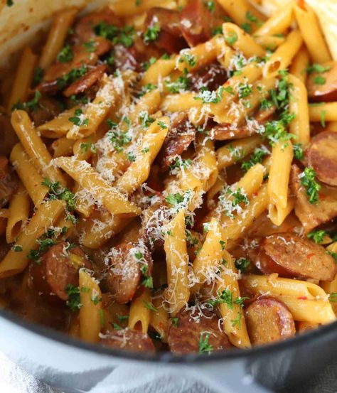 This Kielbasa Pasta is a Cheesy One Pot meal that is ready in just 30 minutes for the best weeknight dinner. It's filled with flavor from the smoky sausage and roasted red peppers to the creamy pasta! Kielbasa And Pasta Recipes, Kielbasa Pasta Recipes, Gouda Recipe, Sausage And Peppers Pasta, Kielbasa Pasta, Sausage Recipes For Dinner, Smoked Sausage Recipes, Red Pepper Pasta, Kielbasa Recipes