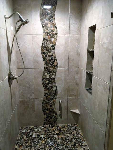 River rock shower wall design Shower Rock Wall, Waterfall Tile Shower Design Accent Wall, Stone Showers Walk In, Rock Shower Wall, River Rock Shower Ideas, Waterfall Tile Shower Design, Rock Shower Ideas, River Rock Shower Floor, Rock Shower Floor