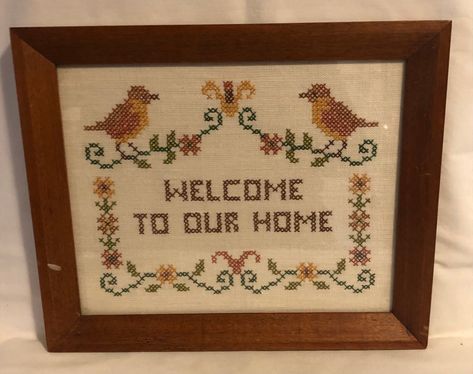 This is a really nice vintage cross stitch. I like the sentiment and nice design with the birds.  The artist did a really nice job finishing it.  On the back there is some information about it being given as a gift and the person who made it.   The cross stitch is very nice with no issues is see. The frame does have some scuff/scratch and the 2 dents in the wood which I have photoed for you.   On the back there is some wear to the paper backing.   I think you'll be able to fix those issues up. All in all looks nice to me  see my photos.  Measuring the frame it is appr 11 1/2" side to side and appr 9 1/2" top to bottom. Cross Stitch Home Decor, Cross Stitch Inspiration, Vintage Cross Stitch, Cross Stitch New Home, New Home Cross Stitch, Funny New Home Cross Stitch, First Home Cross Stitch, Framed Cross Stitch, Yarn Thread