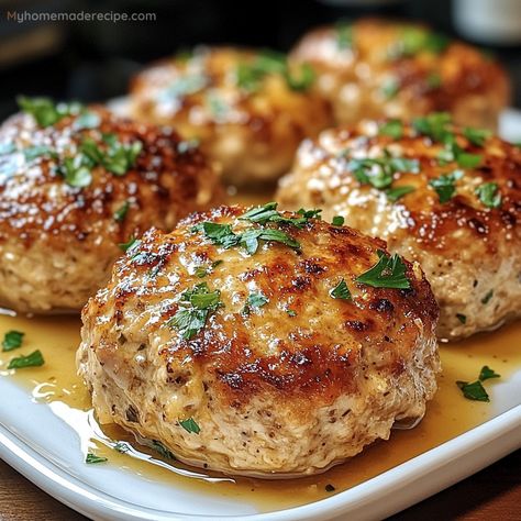 These Garlic Parmesan Chicken Meatloaves are tender, flavorful, and easy to make, featuring a savory blend of garlic, Parmesan, and herbs. Garlic Parmesan Chicken Mini Meatloaves, Family Favorite Meals Dinners, Chicken Parmesan Patties, Chicken Parmesan Mini Meatloaf, Lipton Recipe Secrets Savory Herb With Garlic, Garlic Parmesan Turkey Meatballs, Garlic Parmesan Chicken Meatballs, Garlic Parm Chicken Meatloaves, Garlic Parmesan Meatloaf