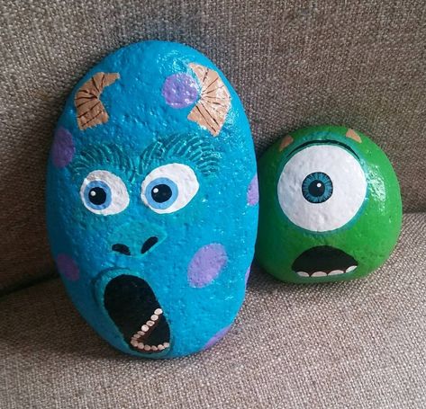 Mike Wazowski and James P. Sullivan Sully Monsters Inc. Painted rocks Rock Painting Ideas Mike Wazowski, Monster Inc Rock Painting, Monsters Inc Painted Rocks, Sully Rock Painting, Mike Wazowski Rock Painting, Mike Wazowski Painting, Painted Rock Garden Ideas, Character Painted Rocks, Painted Rock Garden