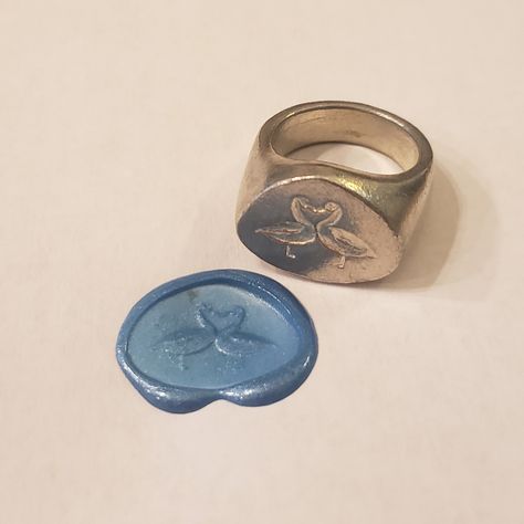 This signet ring is cast in lead-free pewter. The ring size when cast is 7.25 . The sealing image is a couple of geese kissing.       This is part of a series of signet rings I am making cast from lead-free pewter. Each master ring is hand sculpted to give a unique, rustic style, multi-dimensional relief image when used as a stamp to seal, with sealing wax. Luxury Hand Cast Rings For Promise, Wax Carved Ring Silver Signet, Wax Carved Ring Signet, Wax Carved Ring Silver Greek Signet, Luxury Hand Forged Oval Signet Ring, Luxury Hand Cast Signet Ring For Anniversary, Luxury Hand Cast Elegant Signet Ring, Luxury Silver Hand Cast Signet Ring, Luxury Hand Cast Round Signet Ring