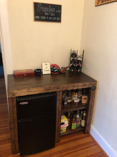 Mini fridge and liquor shelves Mini Bar Man Cave, Mini Refrigerator Ideas, Liquor Cabinet With Mini Fridge, Mini Fridge In Basement Ideas, Mini Bar Apartment Small Spaces, Drink Bar With Mini Fridge, Minibar With Fridge, Mini Fridge Countertop, Bar Cart And Mini Fridge