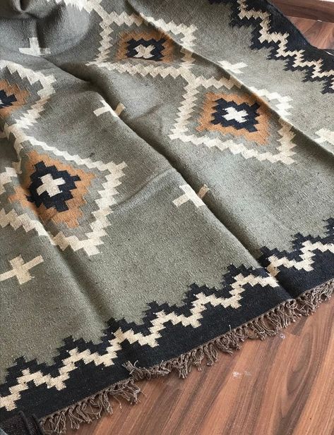 Famous for their rich colors, warm tones, and beautiful ethnic motifs, these flat-woven rugs embody a splendid mix of cultures: the Greeks, Armenians, Kurds, Assyrian, & Turkic peoples have all contributed to kilim history. The dhurrie is handwoven/loomed in jute and the colors make you feel at Bedside Runner, Navajo Rug, Rug Jute, Jute Wool Rug, Indian Rug, Dhurrie Rug, Patterned Rug, Ethnic Motifs, Navajo Rugs