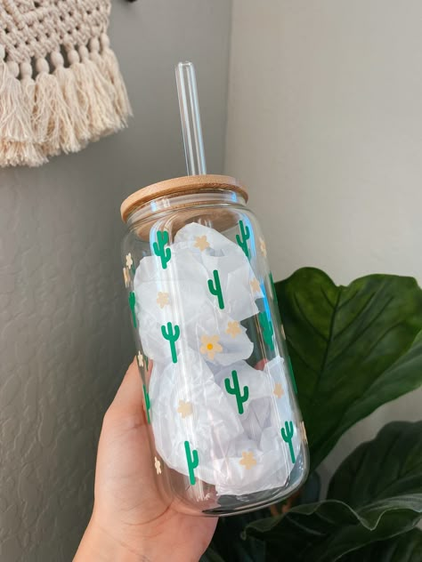 16oz glass can cup with cactus & flower design  These cups need love & care! Please be gentle as they are very delicate. Instructions: * Hand wash only  * No soaking cup or lid in water, straw in just fine to soak :)  * No scrubbing directly on design  * Do not use in microwave/oven  Cup will be secured before shipping for save delivery!  Thanks for shopping! Cute Cup Designs Ideas, Can Glass Cup Design, Custom Cup Ideas, Glass Cup Painting, Glass Cup Design, Cactus Cup, Aesthetic Cups, Glass Tumbler Design, Starbucks Cup Design