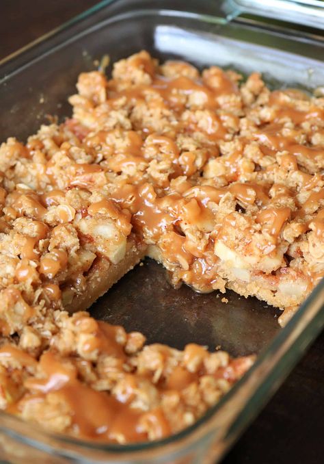 Try these Easy Salted Caramel Apple Pie Bars for a delicious fall or Thanksgiving dessert!  These caramel apple pie bars have a buttery shortbread crust and are made with granny smith apples, a brown sugar-cinnamon oat streusel topping, and are drizzled with an easy homemade salted caramel sauce. The most delicious apple pie bar you'll ever eat! #applepiebars #applepie #saltedcaramel #caramelapple #falldessert Dutch Apple Pie Bars Easy, Carmel Apple Desserts Easy, Apple Streusel Bars, Apple Christmas Dessert, Flaky Apple Pie Bars, Carmel Apple Bars Easy, Buttery Desserts, Thanksgiving Dessert Bars, Thanksgiving Apple Desserts