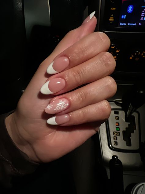 Frosty French Tip Nails, White Tips With Snowflake Nail Design, Simple Snow Flake Nails, French Tip And Snowflake Nails, French Tip With Snowflake On Ring Finger, French Dip Christmas Nails, White French Tip With Snowflake On Ring Finger, Snowflake Nails With French Tip, Almond French Tip Nails With Snowflake