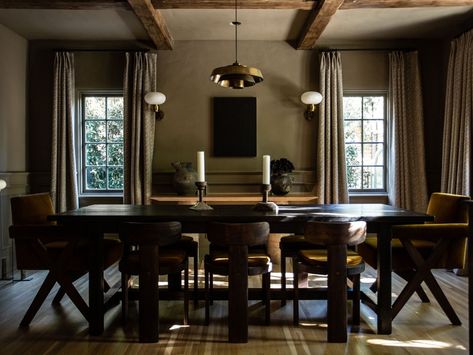 Jake Arnold, Stone Coffee Table, Tudor Style Homes, White Cabinetry, Dining Room Inspiration, Wood Beams, Ceiling Beams, Vintage Chairs, Step Inside