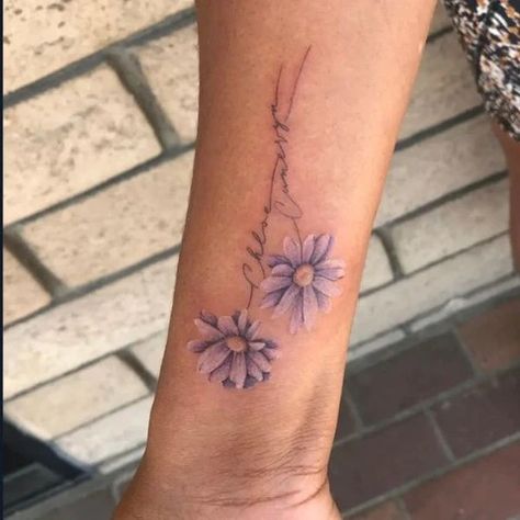 Birth Flower Tattoos: Tattoos For Every Birth Flower – MrInkwells Name In Stem Of Flower Tattoo, Aster Flower Tattoo, Small Daisy Tattoo, Aster Flower Tattoos, Daisy Tattoos, Name Flower Tattoo, Daisy Tattoo Designs, Cool Tattoos For Girls, Daisy Flower Tattoos