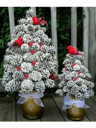 This rustic towering topiary adds understated drama to your winter décor. #pinecones #diy #crafts Pinecone Wedding, Pine Cone Christmas, Creative Christmas Trees, Cone Christmas Trees, Pine Cone Decorations, Cones Crafts, Christmas Decorations Diy Outdoor, Pine Cone Crafts, Winter Diy