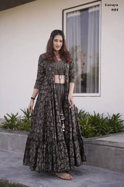 Stunning 3-piece Koti Style Indo-Western Suit of Printed Crop Top, Palazzo And Parallels paired With a Beautiful Printed Shrug Set Fabrics:- Heavy MUSLIN Silk With Digital Printed Work Crop Top Inner Attached Size :- XS-34, S-36, M-38, L-40, XL-42, XXL-44, 3XL-46, 4XL-48, 5XL-50 & 6XL-52 Length :- Shrug - Max Up to 55-57" Crop Top - Max Up to 15" Palazzo - Max Up to 38-40" Flair :- Shrug - Approx 3.00 to 4.40 Mtr. Fancy Crop Top, Western Suit, Western Dresses For Women, Long Gown Design, Printed Crop Top, Lehenga Designs Simple, Traditional Outfit, Designer Dresses Casual, Stylish Party Dresses